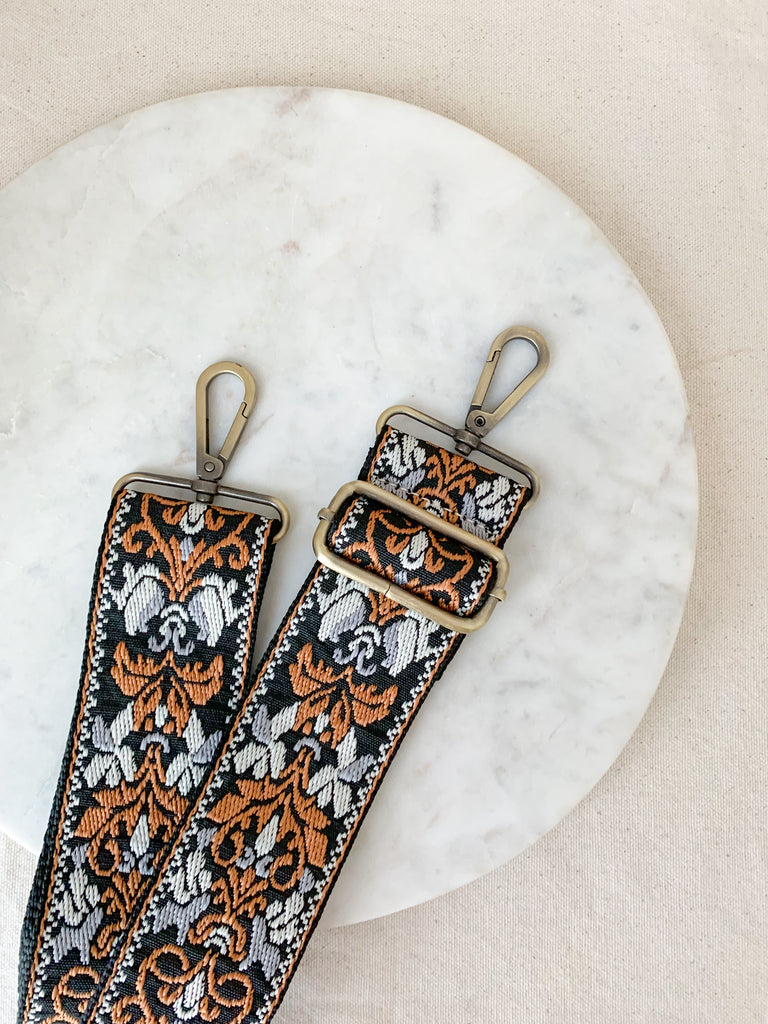 Make your favorite bag pop with these amazing Fabric Guitar Straps! They are so pretty and a very trendy. Each one is unique and durable. You can detach it an add it to any bag. At each end, there are gold tone metal clasps. 