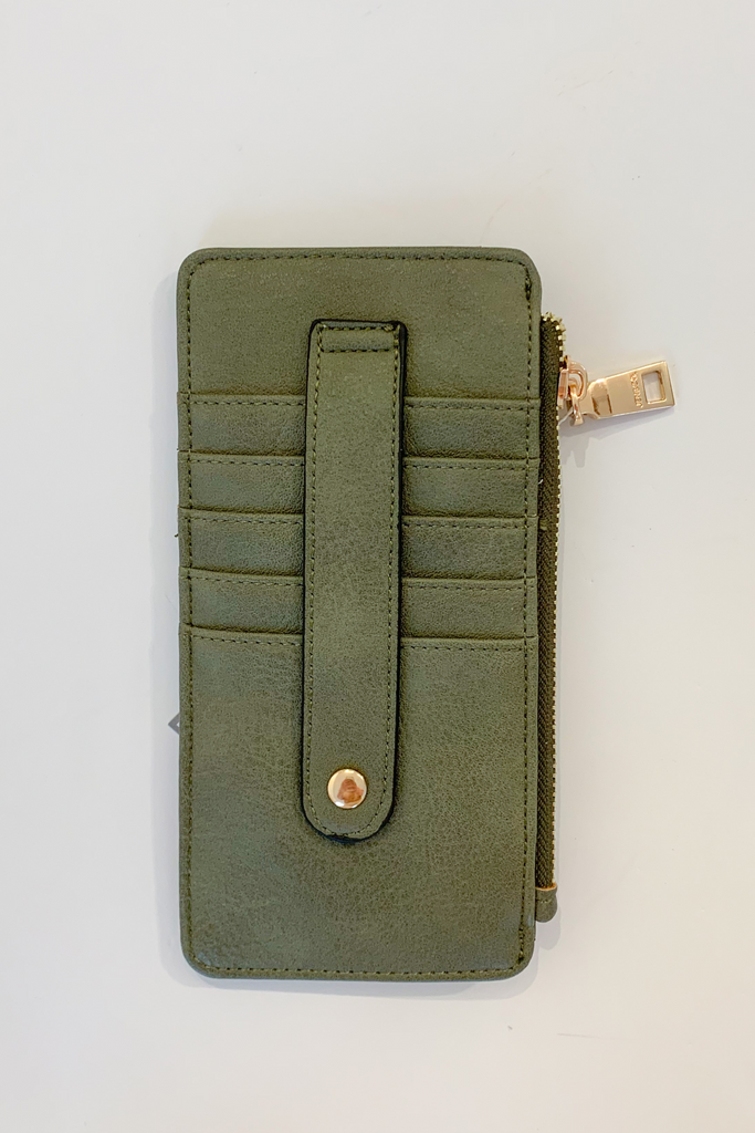 The Fay Slim Wallet with Snap Closure is so cute and convenient! They are slim, but have lots of compartments. You can easily store all of your cards, ID, receipts, and more. These are made with the softest vegan leather too.