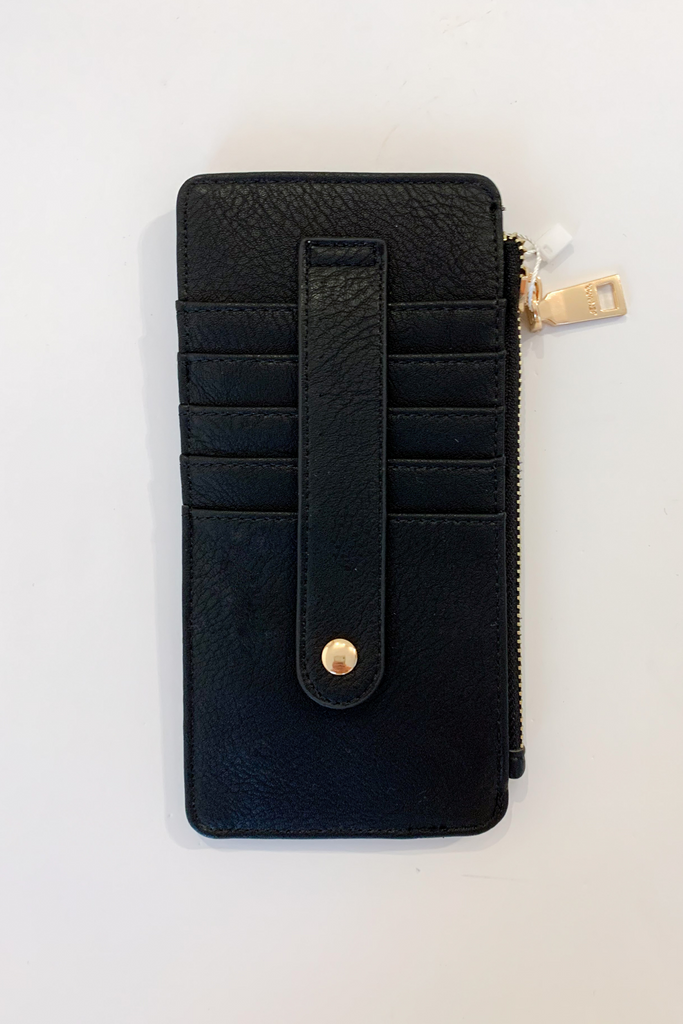 The Fay Slim Wallet with Snap Closure is so cute and convenient! They are slim, but have lots of compartments. You can easily store all of your cards, ID, receipts, and more. These are made with the softest vegan leather too.