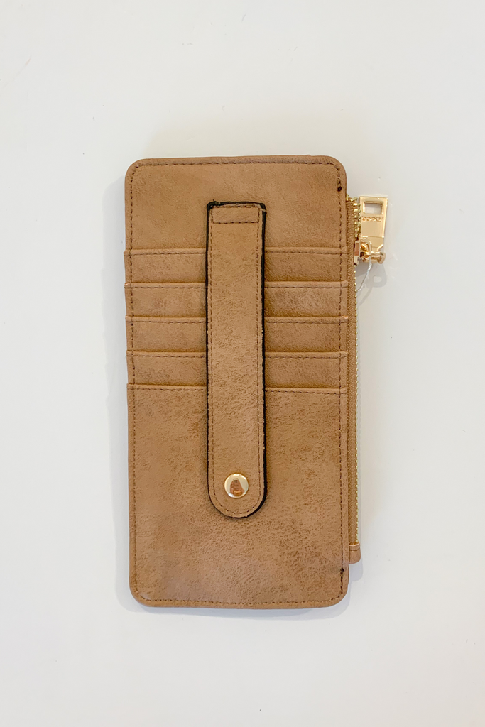 The Fay Slim Wallet with Snap Closure is so cute and convenient! They are slim, but have lots of compartments. You can easily store all of your cards, ID, receipts, and more. These are made with the softest vegan leather too.