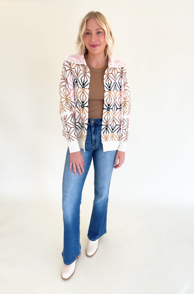 If you are looking for a unique statement piece, the Geometric Pattern Collared Cardigan is a winner! It has a trendy shape with an open front and defined collar. All over the cardigan is a unique brown, blush pink, and black geometric design. It  is a special style that looks chic and effortless. You can pair it over so many styles too, like our Joanie Tanks and Mae Tees.