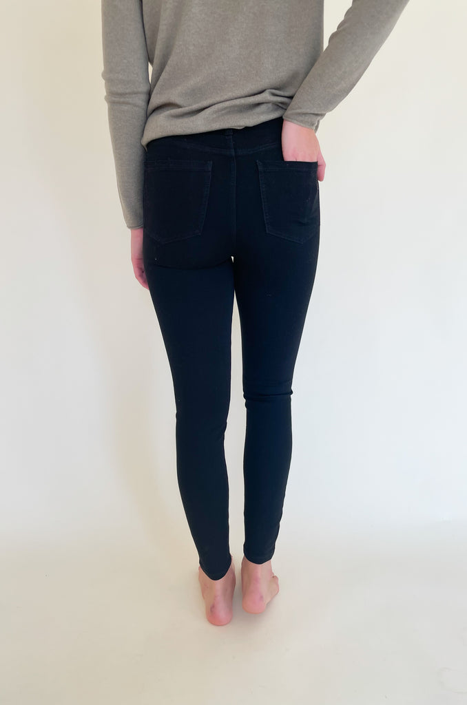 The Gia Glider Pull On Ankle Pants 30" are a black classic skinny jean. The color is perfect for fall and winter, but can really be worn all year long. They are a pull on elastic pant built for comfort. Soft and stretchy doesn't even begin to describe how amazing these pants are! It does not have a zipper, which makes the style look streamlined. You can wear these jeans with any top, blouse, or sweater. They will instantly elevate the look. Try a similar style in Java brown too! 