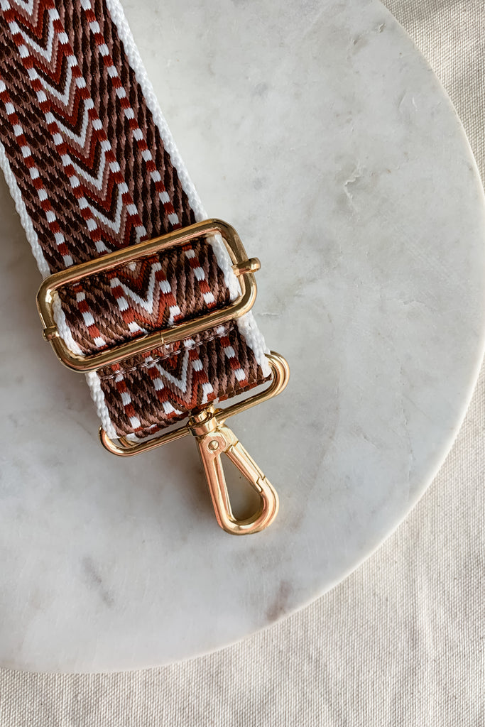 Make your favorite bag pop with these amazing Fabric Guitar Straps! They are so pretty and a very trendy. Each one is unique and durable. You can detach it an add it to any bag. At each end, there are gold tone metal clasps. 