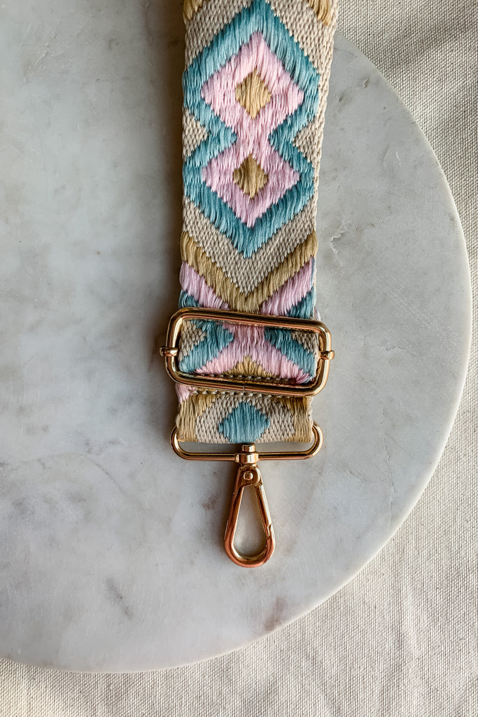 Make your favorite bag pop with these amazing Fabric Guitar Straps! They are so pretty and a very trendy. Each one is unique and durable. You can detach it an add it to any bag. At each end, there are gold tone metal clasps. 