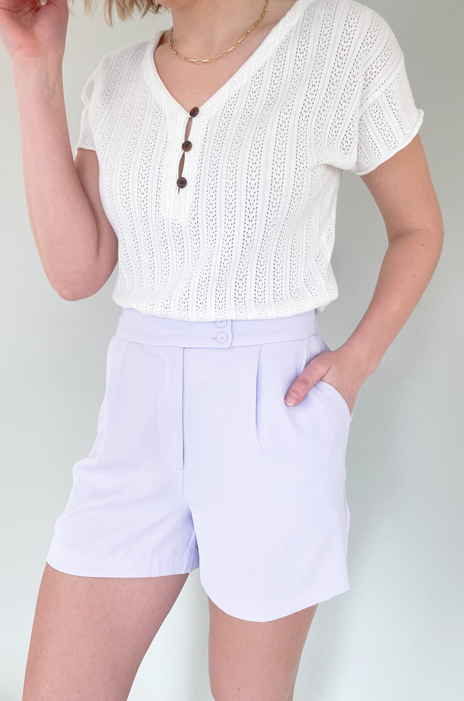 The Heidi Tailored Elastic Back Shorts are so fun! The pops of color are so trendy right now. Plus, the fabric is so elevated. It has an elastic waist band, pockets, a zipper fly, and pleats. It also has two buttons on the front. 
