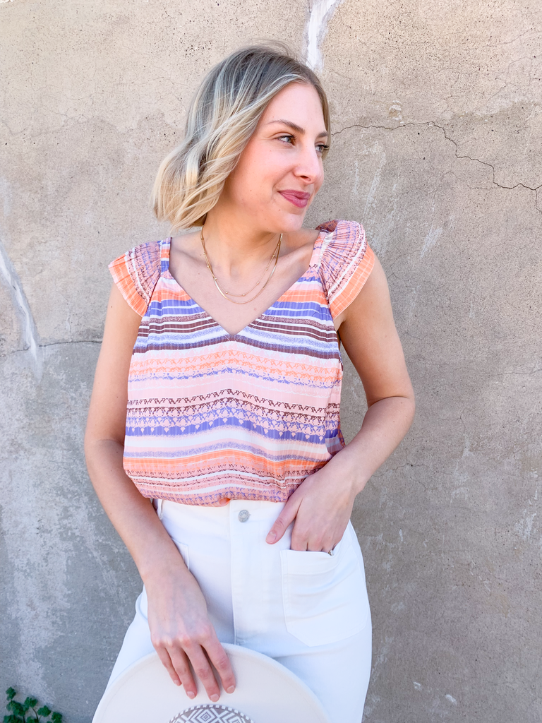 Be a trendsetter in this fluttering, flirty Contrast Pleated Flutter Sleeve Shirt! In a showstopping orange and blue, plus ivory abstract print, you'll have everyone's eyes on you. Super silky, with pleats of perfection, this blouse is perfect for special events, date night, birthdays, you name it! 