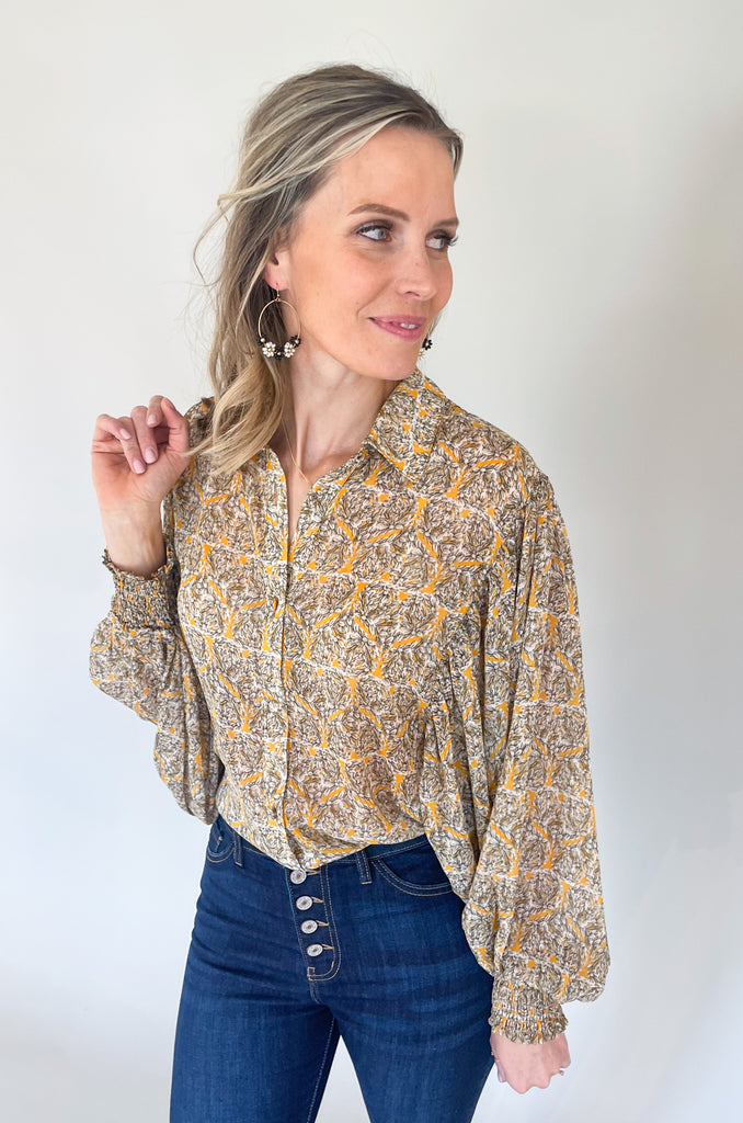 The Jolene Boho Blouse is absolutely gorgeous! It has a unique abstract floral design that resembles hearts. Throughout the blouse, there are stripes of lurex. This adds a shimmery detail that looks so elevated. 