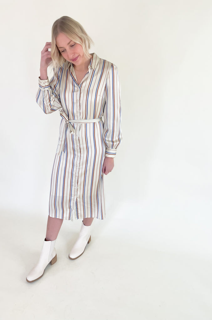 The Jump Back Stripe Long Sleeve Dress is such a gorgeous style that can be worn all year. The fabric is an elevated silk-like material that feels luxurious. We love the button up style with the waist belt. It is flattering on several body types and effortless! Plus, the colors are fun and timeless. 