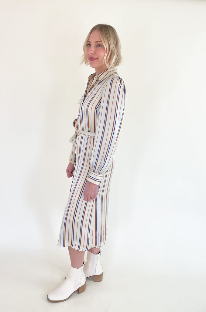The Jump Back Stripe Long Sleeve Dress is such a gorgeous style that can be worn all year. The fabric is an elevated silk-like material that feels luxurious. We love the button up style with the waist belt. It is flattering on several body types and effortless! Plus, the colors are fun and timeless. 