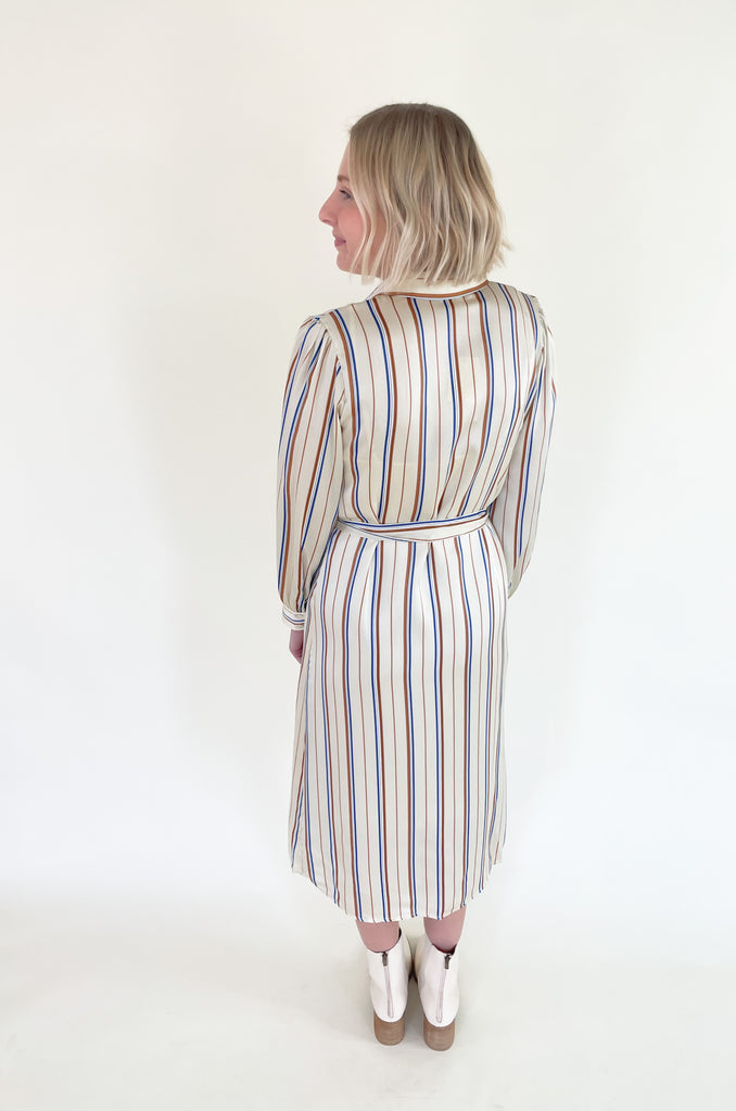 The Jump Back Stripe Long Sleeve Dress is such a gorgeous style that can be worn all year. The fabric is an elevated silk-like material that feels luxurious. We love the button up style with the waist belt. It is flattering on several body types and effortless! Plus, the colors are fun and timeless. 