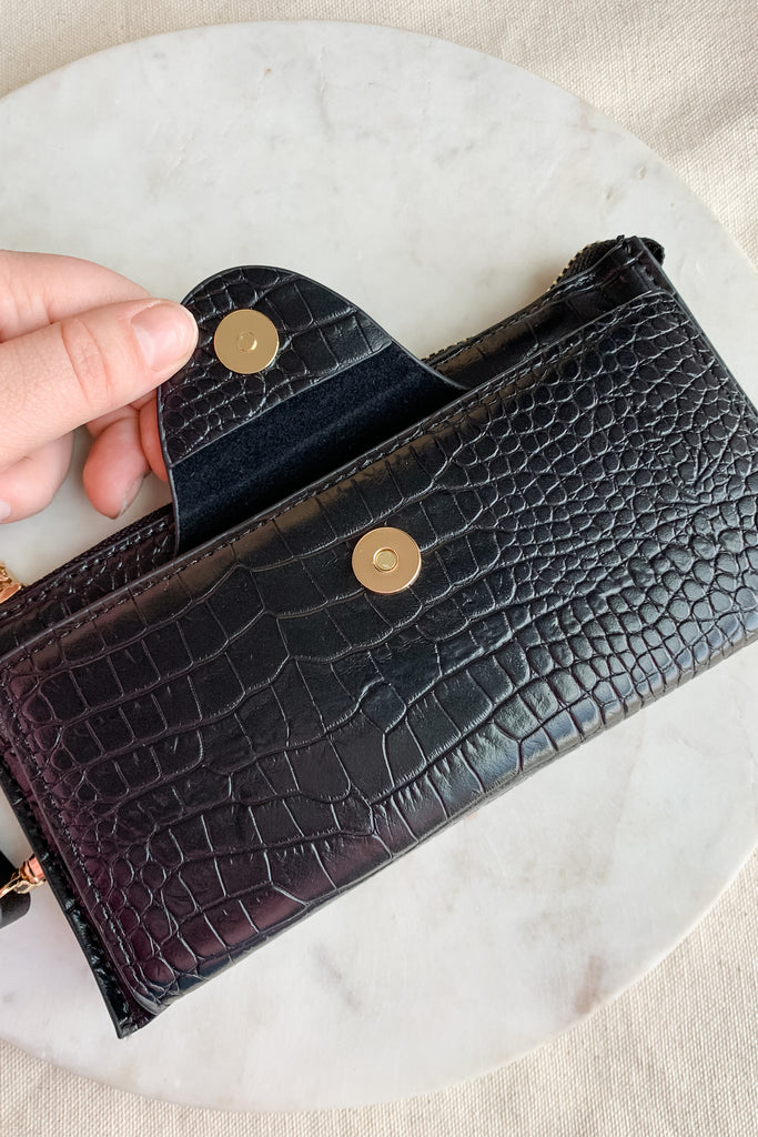 The Kyla Wristlet Strap Wallet is so chic and easy to take anywhere! It is big enough to carry everything you need and has a wristlet band for on the go.  The Kyla Wallet is Vegan Leather and very durable. We love it! Choose between several colors to go with any of our new handbags.