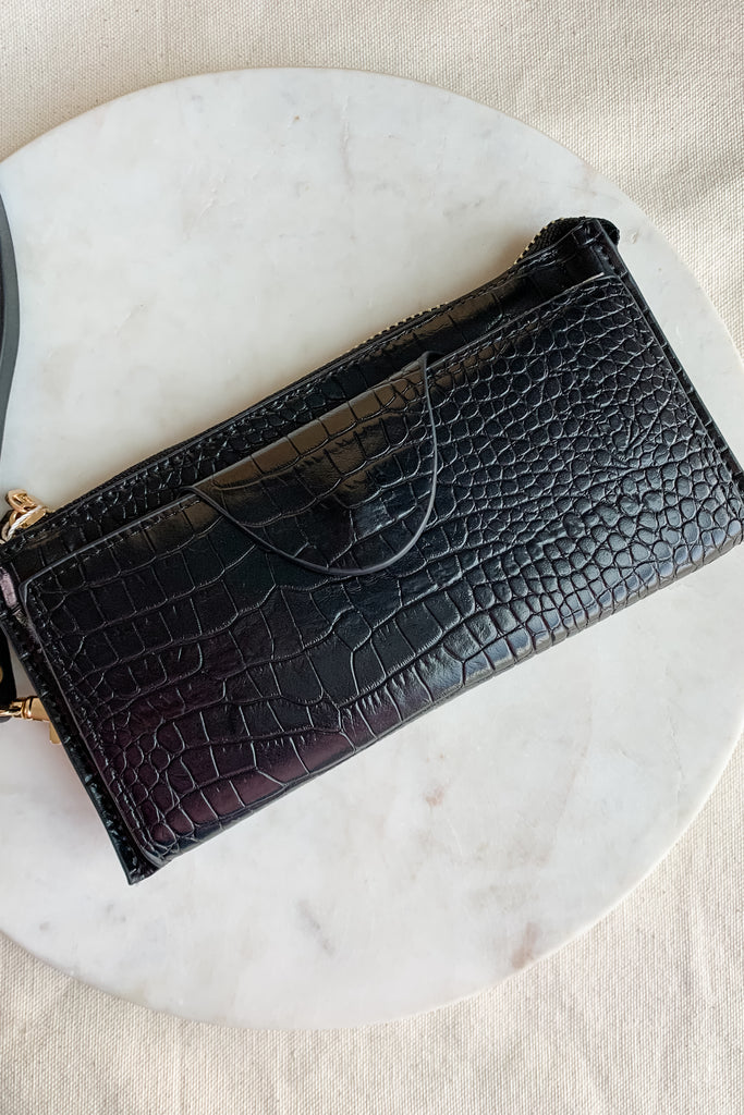 The Kyla Wristlet Strap Wallet is so chic and easy to take anywhere! It is big enough to carry everything you need and has a wristlet band for on the go.  The Kyla Wallet is Vegan Leather and very durable. We love it! Choose between several colors to go with any of our new handbags.