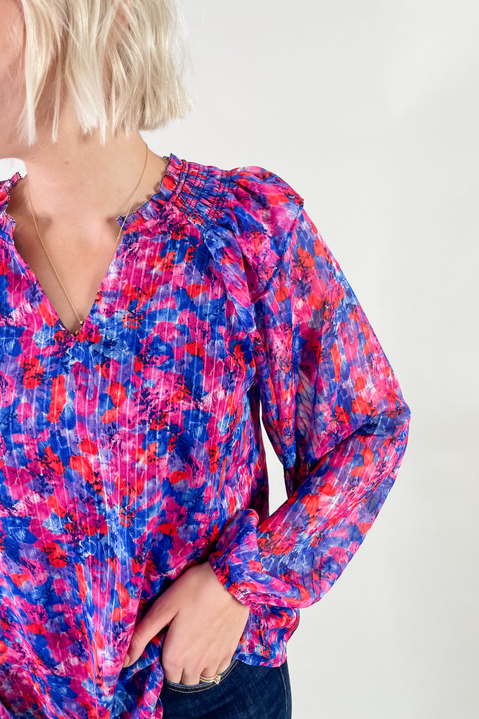 Bright Hot Pink, Red, and Royal Blue Floral Blouse with ruffle details. It is available in sizes XSmall-3X