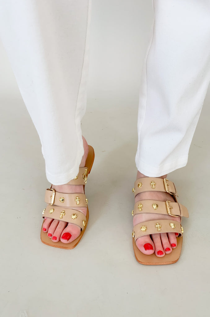 The Lana Triple Strap Studded Sandals are so fun for spring and summer! The unique gold studs give this shoe a designer look. They are flat and easy to walk in, plus they have adjustable straps for the perfect fit. 