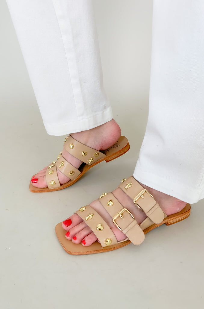 The Lana Triple Strap Studded Sandals are so fun for spring and summer! The unique gold studs give this shoe a designer look. They are flat and easy to walk in, plus they have adjustable straps for the perfect fit. 