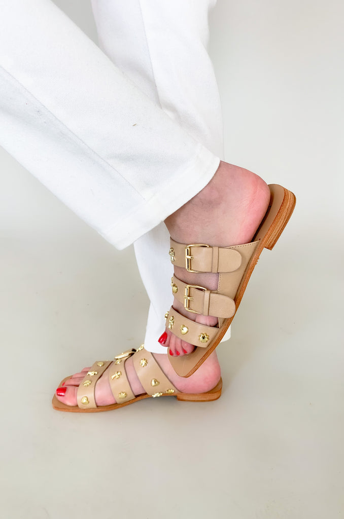 The Lana Triple Strap Studded Sandals are so fun for spring and summer! The unique gold studs give this shoe a designer look. They are flat and easy to walk in, plus they have adjustable straps for the perfect fit. 