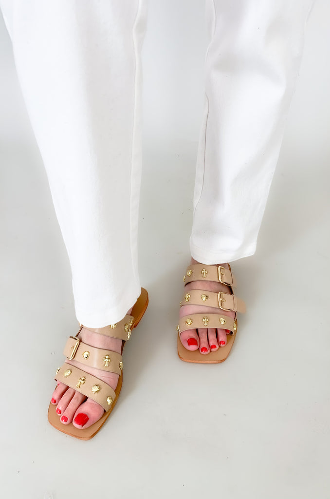 The Lana Triple Strap Studded Sandals are so fun for spring and summer! The unique gold studs give this shoe a designer look. They are flat and easy to walk in, plus they have adjustable straps for the perfect fit. 