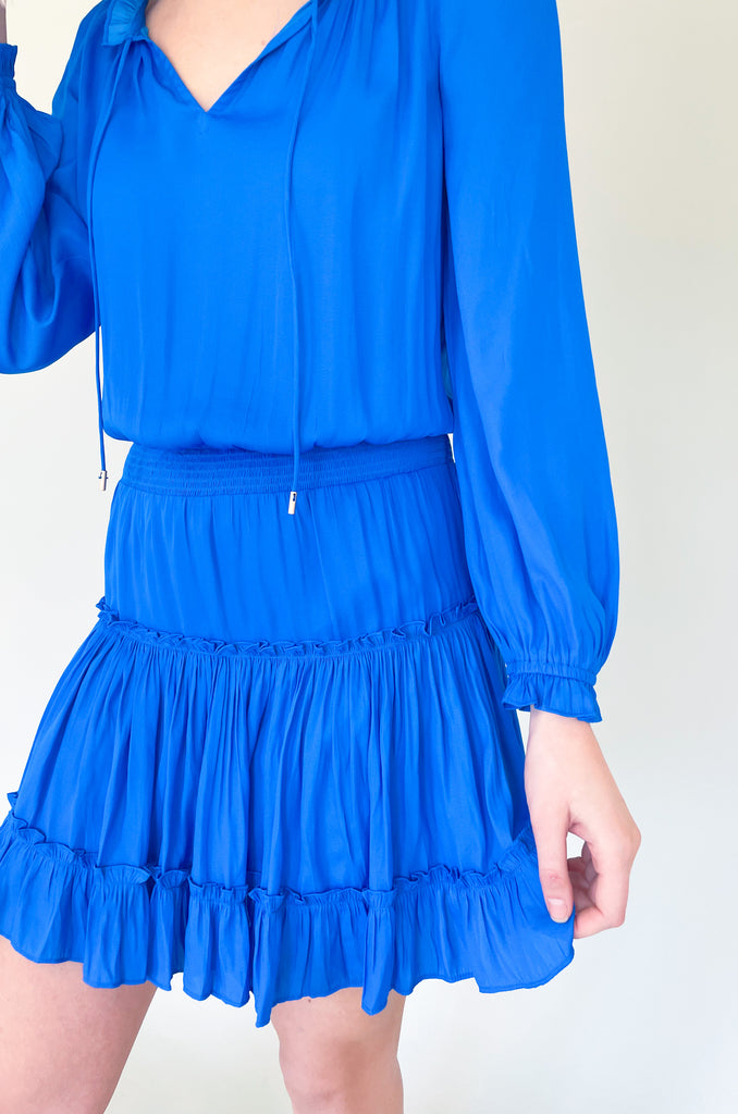 The Long Sleeve Ruffle Party Dress is a "WOW" piece! That bright cobalt blue color makes a statement, along with the other stunning details on this dress. The fabric is silky and elevated. It has long sleeves that helps balance the above the knee length. With the tiered shape, it gives a flattering flounce too. This style is a go-to for special events!