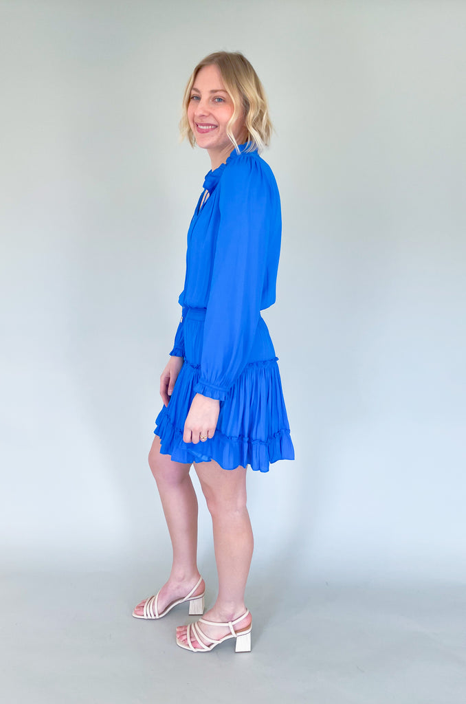 The Long Sleeve Ruffle Party Dress is a "WOW" piece! That bright cobalt blue color makes a statement, along with the other stunning details on this dress. The fabric is silky and elevated. It has long sleeves that helps balance the above the knee length. With the tiered shape, it gives a flattering flounce too. This style is a go-to for special events!