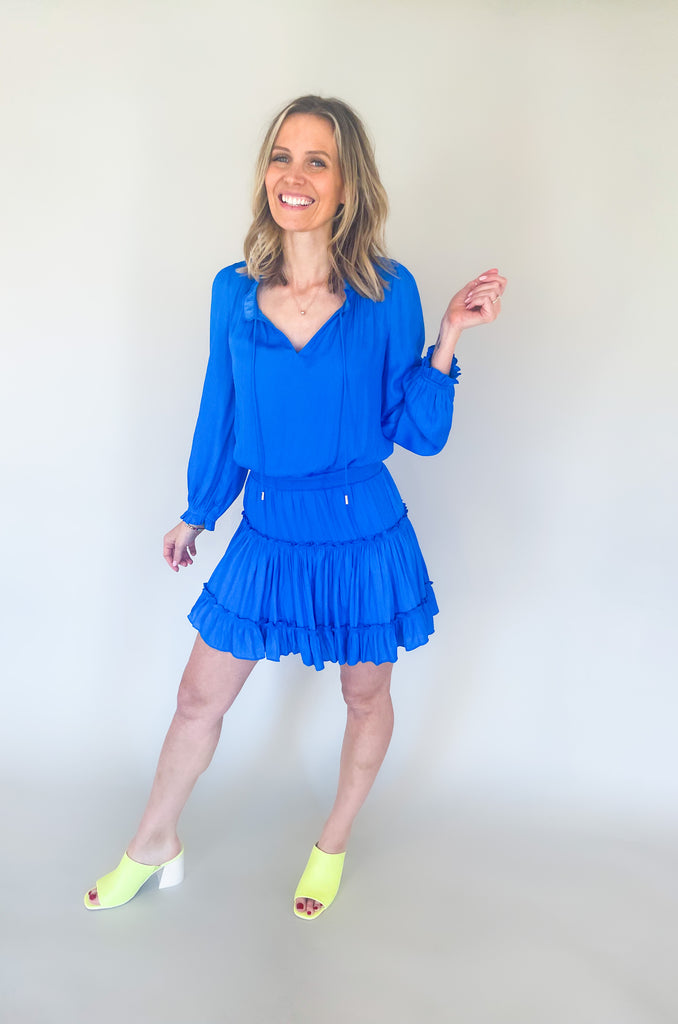 The Long Sleeve Ruffle Party Dress is a "WOW" piece! That bright cobalt blue color makes a statement, along with the other stunning details on this dress. The fabric is silky and elevated. It has long sleeves that helps balance the above the knee length. With the tiered shape, it gives a flattering flounce too. This style is a go-to for special events!