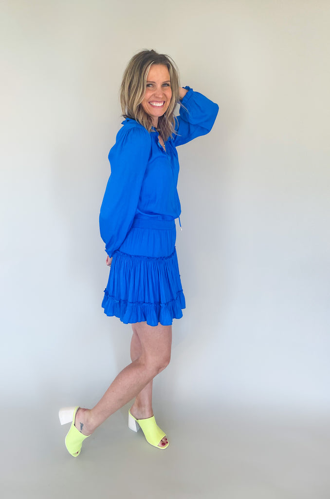 The Long Sleeve Ruffle Party Dress is a "WOW" piece! That bright cobalt blue color makes a statement, along with the other stunning details on this dress. The fabric is silky and elevated. It has long sleeves that helps balance the above the knee length. With the tiered shape, it gives a flattering flounce too. This style is a go-to for special events!