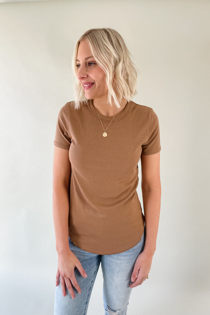 The Mae Short Sleeve Ribbed Tee is an amazing basic to have. It is better than an average shirt and has subtle details we love. The top has a ribbed fabric, which smooths the body and looks so chic. It comes in a few colors and pairs with everything too!