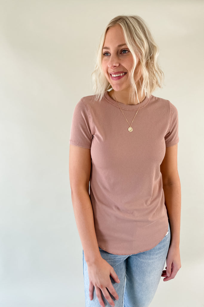 The Mae Short Sleeve Ribbed Tee is an amazing basic to have. It is better than an average shirt and has subtle details we love. The top has a ribbed fabric, which smooths the body and looks so chic. It comes in a few colors and pairs with everything too!