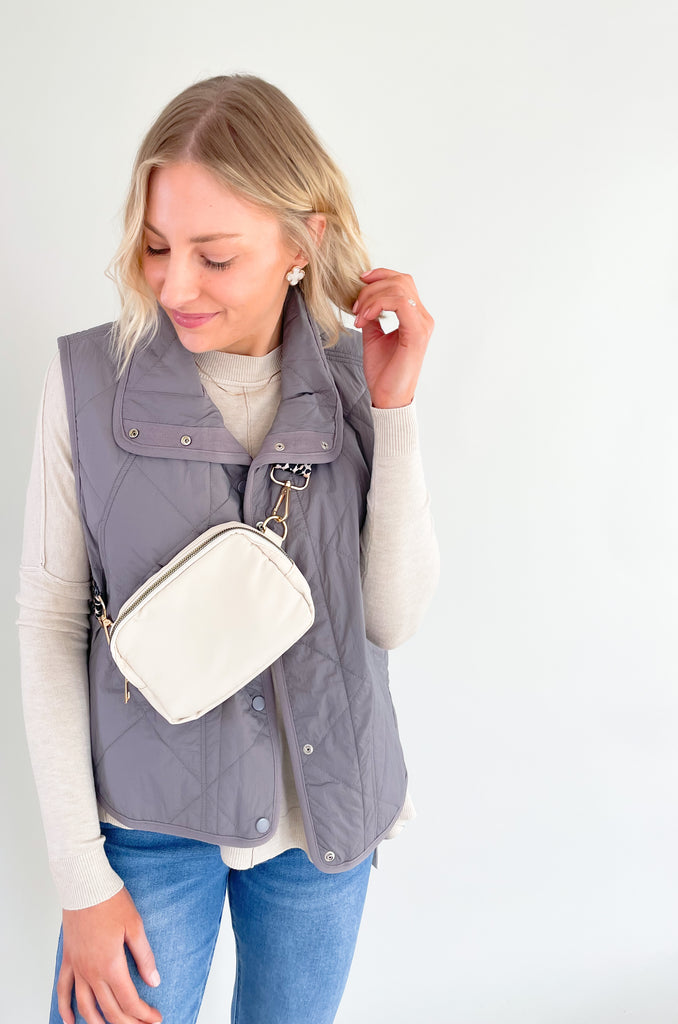 Pewter or sage snap button quilted vest. It's lightweight and perfect for spring layering!