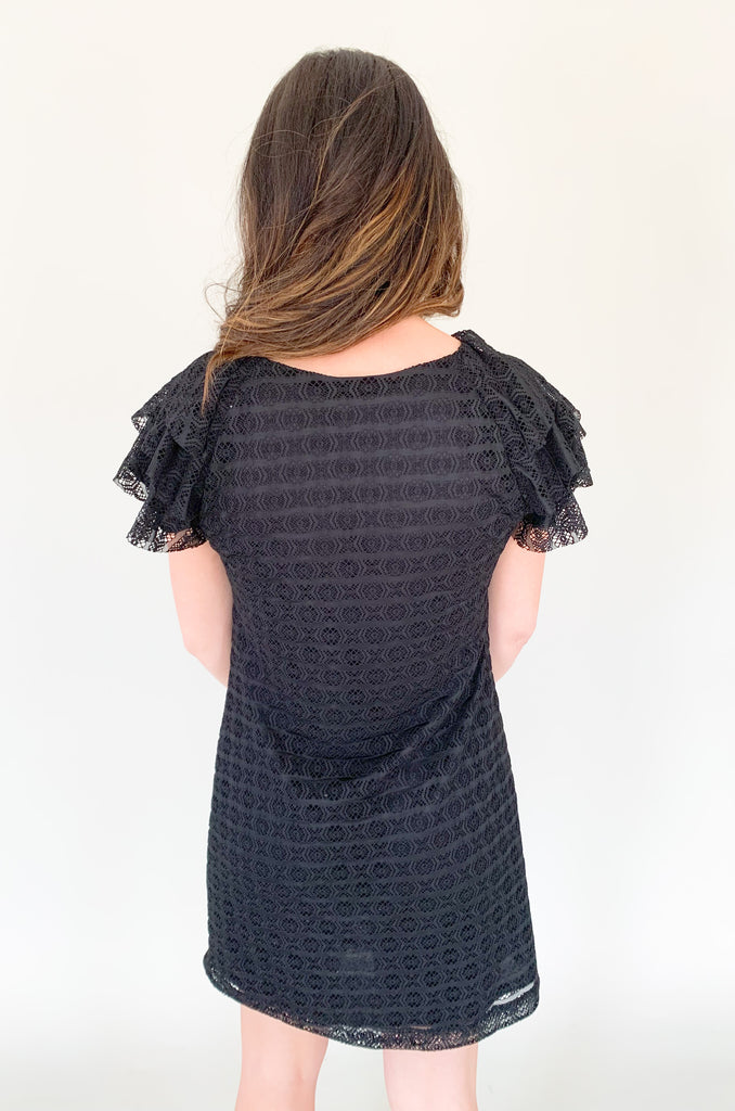 This stunning Meredith Layered Lace Dress black dress with delicate lace and flutter sleeves  is the perfect combination of comfort and elegance, making it a must-have for any occasion.
