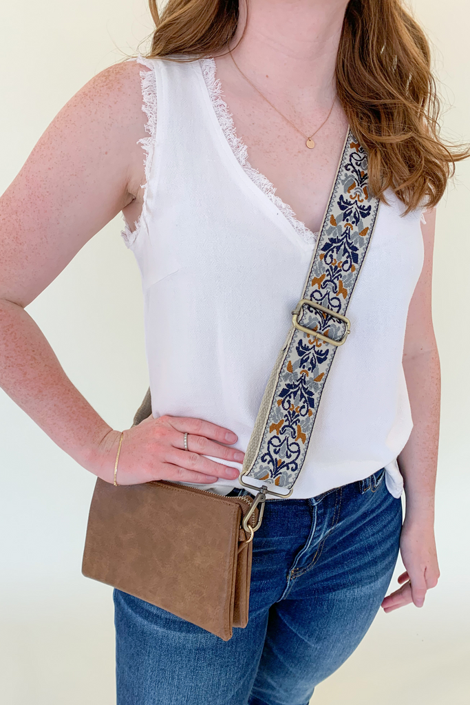 The Miley Crossbody/Wristlet  bag is perfect for on-the-go! It can be work 6 ways. Wear it as a crossbody bag, wristlet, clutch, shoulder bag, sling bag, or as a belt bag! Pair it with one of our Fabric Guitar Straps as pictured for that sling bag look. We love the versatility and all the colors.