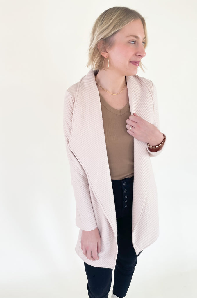 The Oaklynn Open Front Long Cardigan is elevated, chic, and timeless. You can easily dress it up or down for any event, making it such a versatile piece. The fabric is soft and stretchy too. There is a unique chevron stitching all over the cardigan for detail. We cannot say enough good things about this style- it's a must have! 