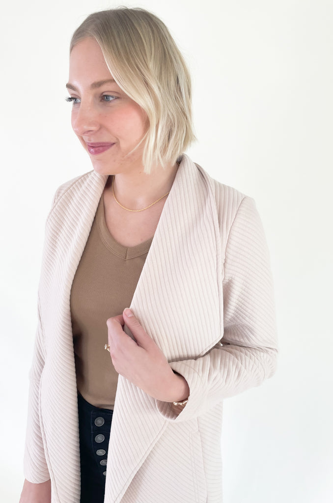 The Oaklynn Open Front Long Cardigan is elevated, chic, and timeless. You can easily dress it up or down for any event, making it such a versatile piece. The fabric is soft and stretchy too. There is a unique chevron stitching all over the cardigan for detail. We cannot say enough good things about this style- it's a must have! 