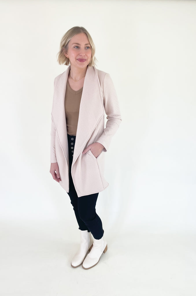 The Oaklynn Open Front Long Cardigan is elevated, chic, and timeless. You can easily dress it up or down for any event, making it such a versatile piece. The fabric is soft and stretchy too. There is a unique chevron stitching all over the cardigan for detail. We cannot say enough good things about this style- it's a must have! 