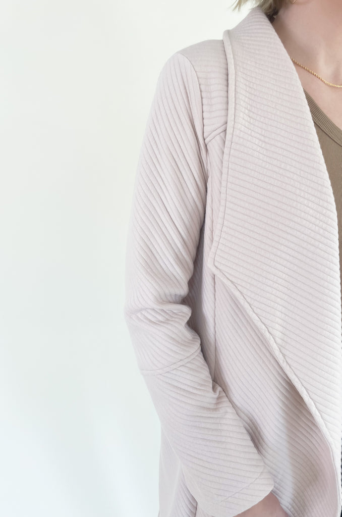 The Oaklynn Open Front Long Cardigan is elevated, chic, and timeless. You can easily dress it up or down for any event, making it such a versatile piece. The fabric is soft and stretchy too. There is a unique chevron stitching all over the cardigan for detail. We cannot say enough good things about this style- it's a must have! 