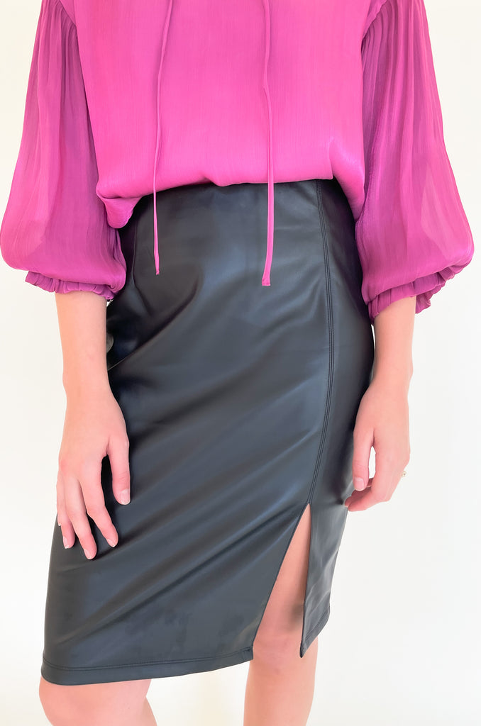 The Liverpool  black Pencil Skirt with 23.5" slit is so elevated and chic. This is the perfect work or date night skirt, and pairs beautifully with so many tops. We styled it with our new voluminous blouse for a fun look! 