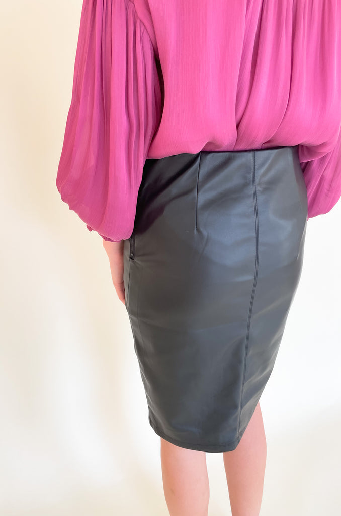 The Liverpool  black Pencil Skirt with 23.5" slit is so elevated and chic. This is the perfect work or date night skirt, and pairs beautifully with so many tops. We styled it with our new voluminous blouse for a fun look! 