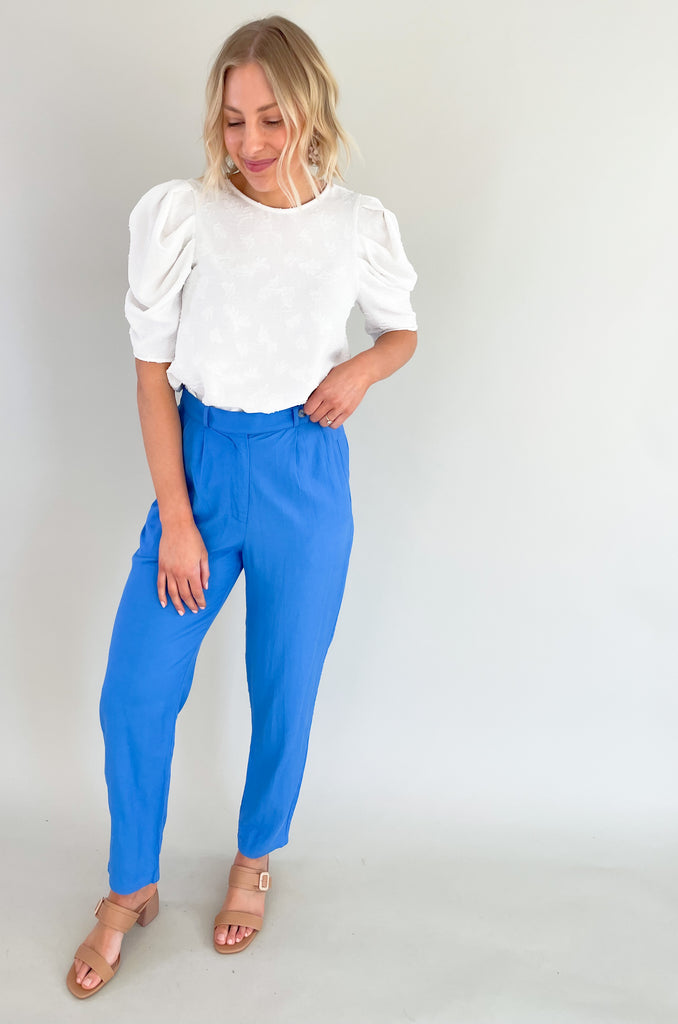 Get ready to turn heads in these show-stopping, vibrant blue Woven Front Pleated Pants. They are an easy way to add a unique touch to a basic outfit. You can dress them up with a blouse, or wear them casually with a solid tank or tee. Crafted with high-quality materials, these pants are durable, breathable, and comfortable to wear all day long.