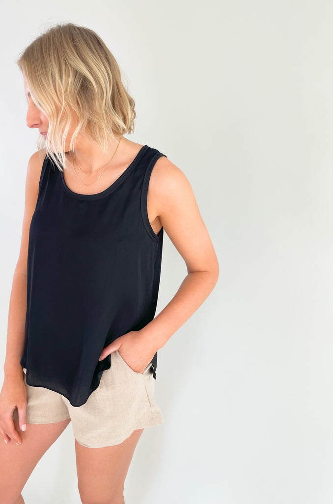 Elevated tanks make the look! Whether you are wearing the Camryn Casual Round Neck Tank on its own, or layering it under your favorite jacket or cardigan, this style is a go to! It's chic, elevated, and comes in three classic colors sage, black, and ivory. The silky look is a nice touch to every outfit. 