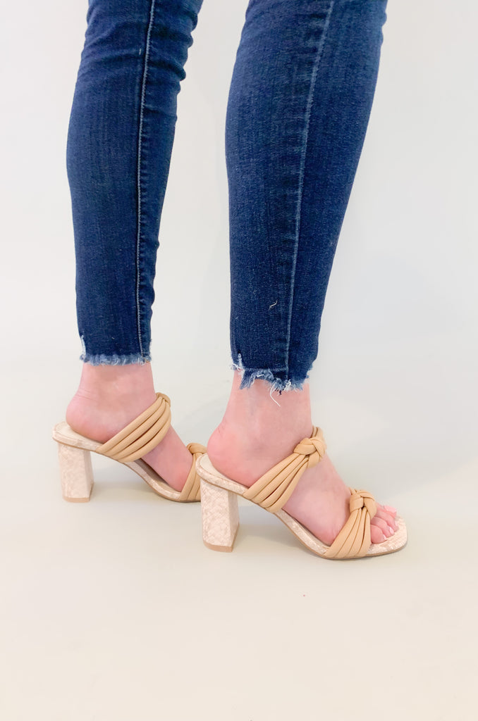 The Raquel Knotted Double Strap Heeled Sandals have so many amazing details! We are loving the neutral tone combined with the fun snakeskin print along the heel. This shoe has multiple straps over the top tied together with a unique knot detail. These shoes look so elevated, but also are very comfortable. Dress them up or down to complete your look! 