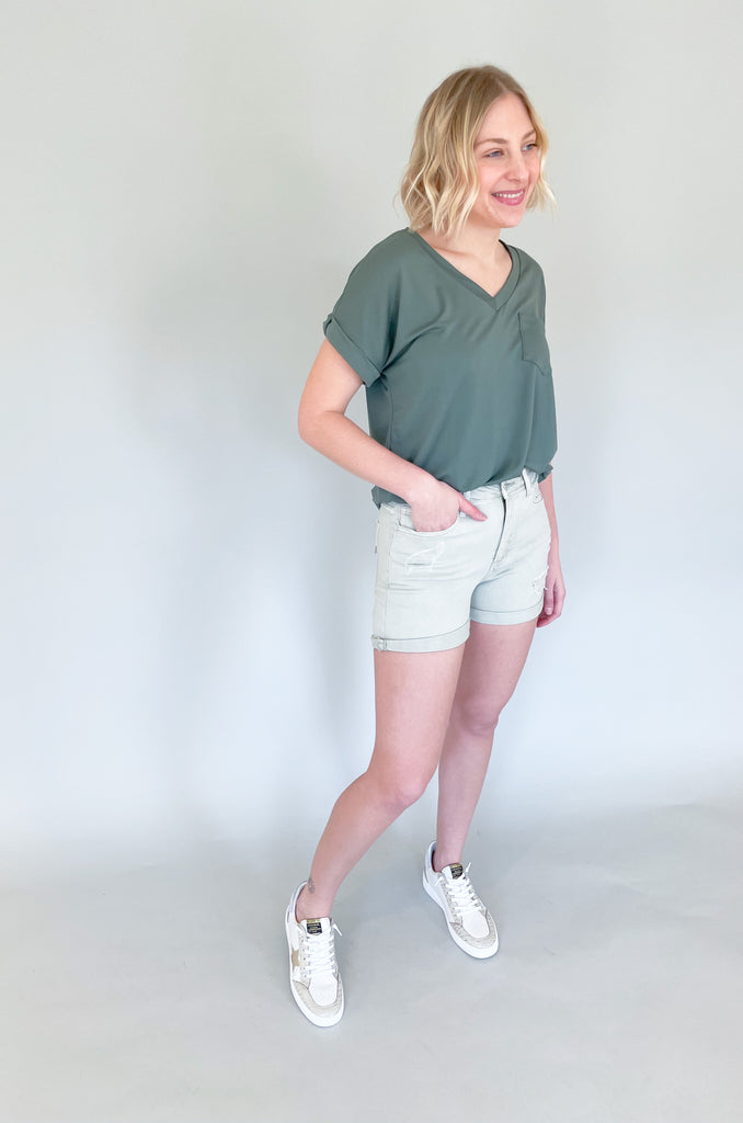 The Rebecca High Rise Distressed Shorts have a fresh look for spring and summer. Colored bottoms create an elevated outfit, plus they are just fun! This style is a washed, olive green with distressing on the front and back. The bottom hem can be unrolled to create a longer short. The fabric is soft and stretchy too! 