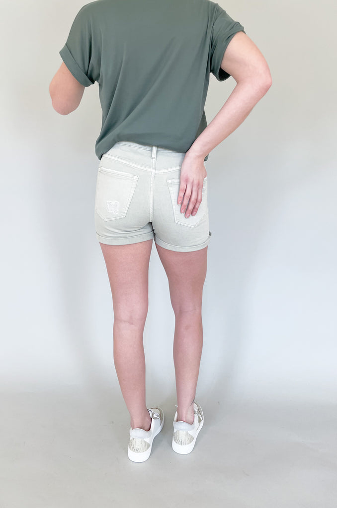 The Rebecca High Rise Distressed Shorts have a fresh look for spring and summer. Colored bottoms create an elevated outfit, plus they are just fun! This style is a washed, olive green with distressing on the front and back. The bottom hem can be unrolled to create a longer short. The fabric is soft and stretchy too! 