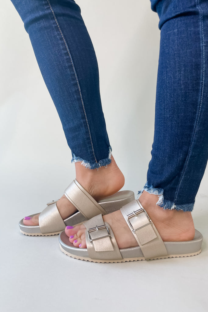 Rogue Double Buckle Footed Sandal is perfect for spring or your next vacation! It comes in two perfect colors, Champagne and Camel, that match with everything. With the two buckles you can adjust the fit. They are very comfortable and functional too. 