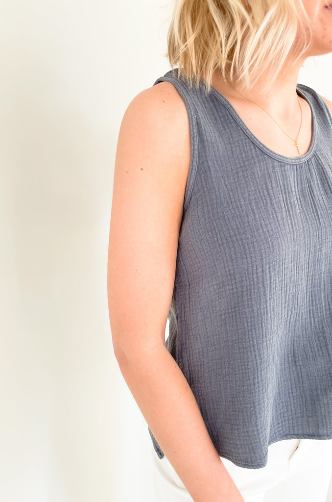 Meet the Still Here Side Slit Gauze Tank: a navy blue shirt made for everyday! With its semi-cropped fit and gauzy fabric, this tank will keep you looking fly and feelin' cool whether you're running errands or heading out for the evening. It's soft, elevated, and lightweight too! 