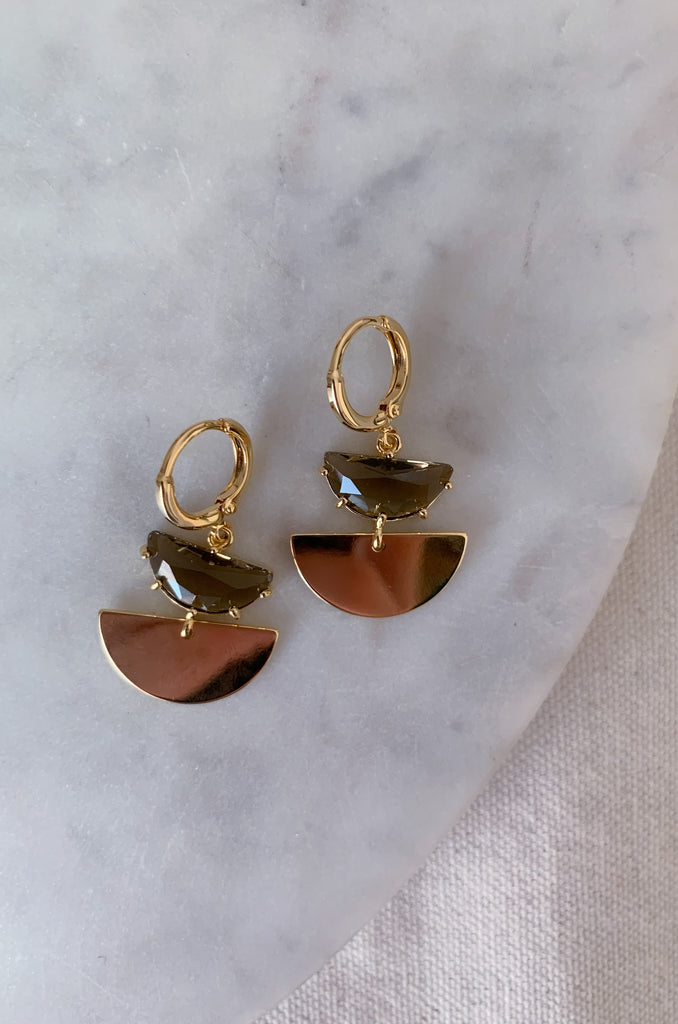 The Stone & Half Gold Circle Earrings are another statement piece, but with a boho vibe. We are loving geometric shapes right now, so this earring is right on trend. They have a back clasp. The design is comfortable and easy to wear. You cannot go wrong with this one! Choose between clear or grey to complete your next look.