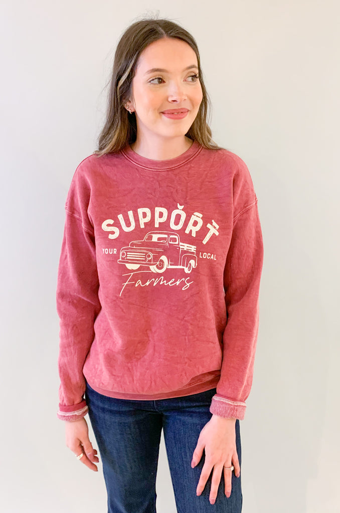 The Support Farmers Truck Mineral Washed Pullover is a cute and casual style, perfect for everyday wear. It has a unique graphic print and a fun, mineral-wash look. Because of the dying process, each pullover is slightly different in color variation. On the inside, this style is lined with the coziest fleece. You will be reaching for it again and again!