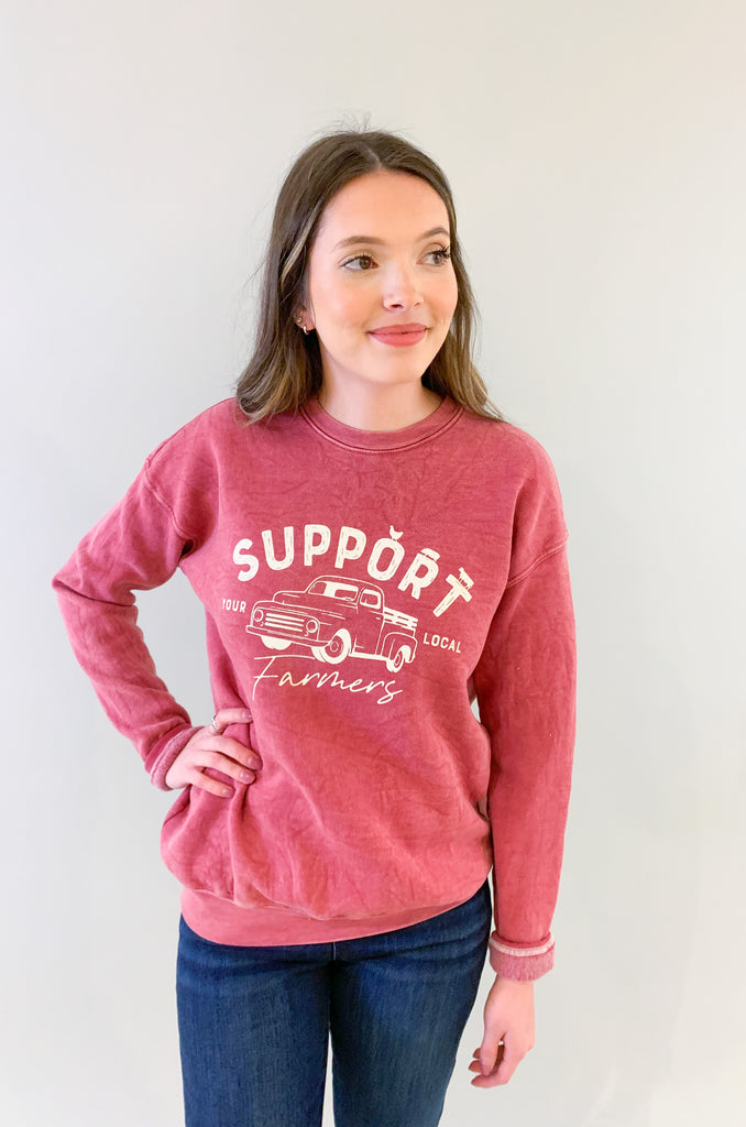 The Support Farmers Truck Mineral Washed Pullover is a cute and casual style, perfect for everyday wear. It has a unique graphic print and a fun, mineral-wash look. Because of the dying process, each pullover is slightly different in color variation. On the inside, this style is lined with the coziest fleece. You will be reaching for it again and again!