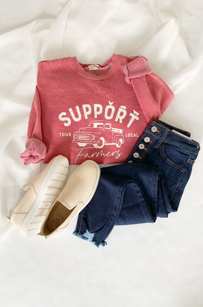 The Support Farmers Truck Mineral Washed Pullover is a cute and casual style, perfect for everyday wear. It has a unique graphic print and a fun, mineral-wash look. Because of the dying process, each pullover is slightly different. On the inside, this style is lined with the coziest fleece. You will be reaching for it again and again!