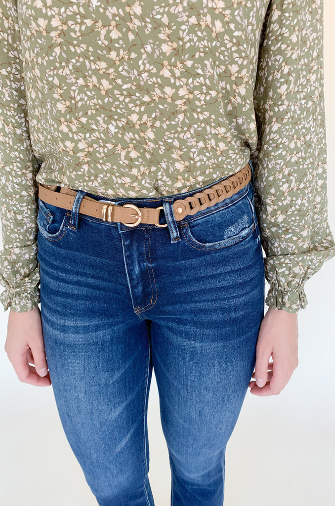 The Tan Woven Link with Gold Rings Belt is 42" long with so much detail! It has a unique fishtail braid connected by gold rings. It's adjustable too. 