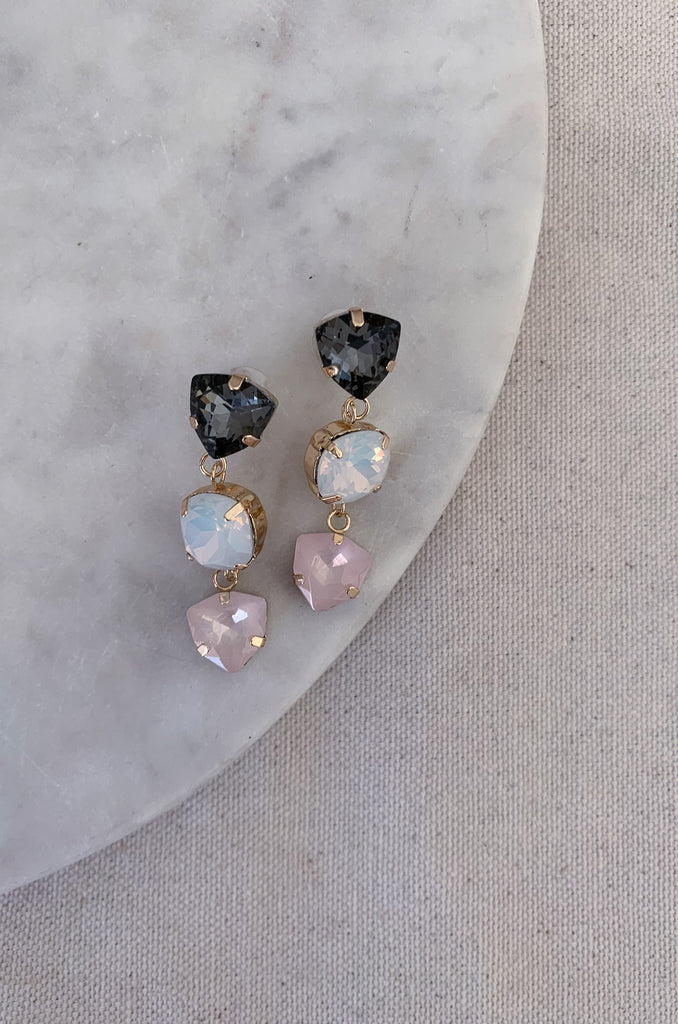 Triple Crystal Dangle Earrings are showstoppers! They sparkle and shine, creating the perfect look for your next event. Think weddings, family photos, parties, and more. This style is so comfortable too. The colors are stunning and will surely go with so many looks. Choose between Black, Blush, or both for your next night out.