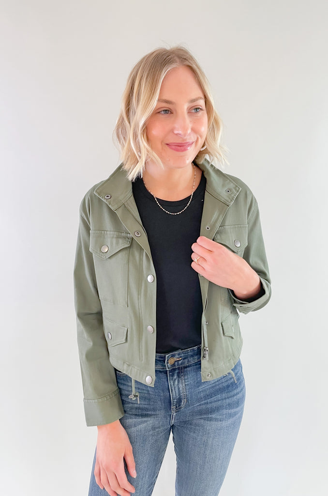 Mission accomplished: taking your style to new heights with this elevated army green Liverpool Cropped Utility Cargo Jacket! It's perfect for the woman that wants fun pieces that still feel timeless. The Liverpool soft touch twill has amazing stretch and a touch of edge too. Try wearing it with our matching trousers!
